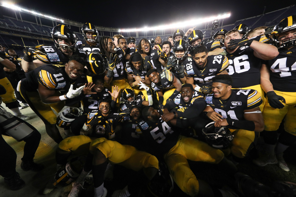 The Iowa Hawkeyes celebrate their win against USC in the Holiday Bowl Friday, December 27, 2019 at San Diego Community Credit Union Stadium. (Brian Ray/hawkeyesports.com)