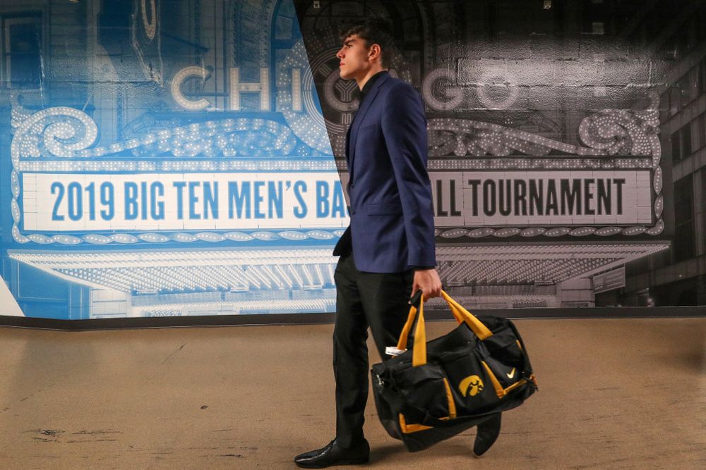 Iowa Hawkeyes forward Luka Garza (55) arrives for their game against the Illinois Fighting Illini in the 2019 Big Ten Men's Basketball Tournament Thursday, March 14, 2019 at the United Center in Chicago. (Brian Ray/hawkeyesports.com)