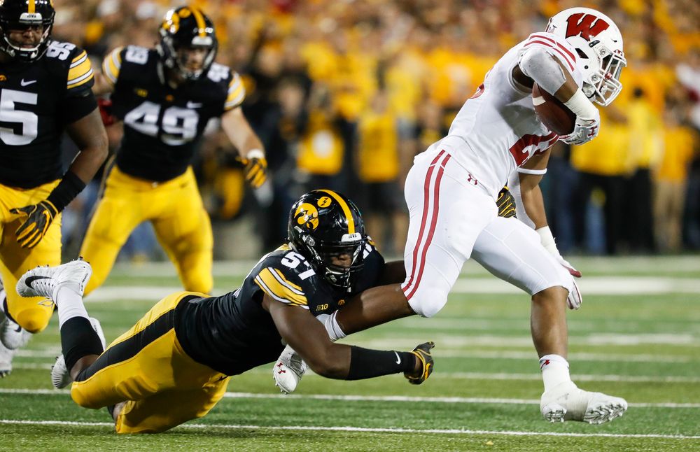 Iowa Hawkeyes defensive end Chauncey Golston (57) makes a tackle during a game against Wisconsin at Kinnick Stadium on September 22, 2018. (Tork Mason/hawkeyesports.com)