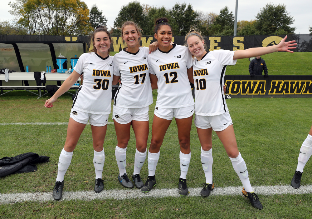Iowa Hawkeyes forward Devin Burns (30), defender Hannah Drkulec (17), forward Olivia Fiegel (12), and midfielder/defender Natalie Winters (10) before their game against the Maryland Terrapins Sunday, October 13, 2019 on senior day. (Brian Ray/hawkeyesports.com)