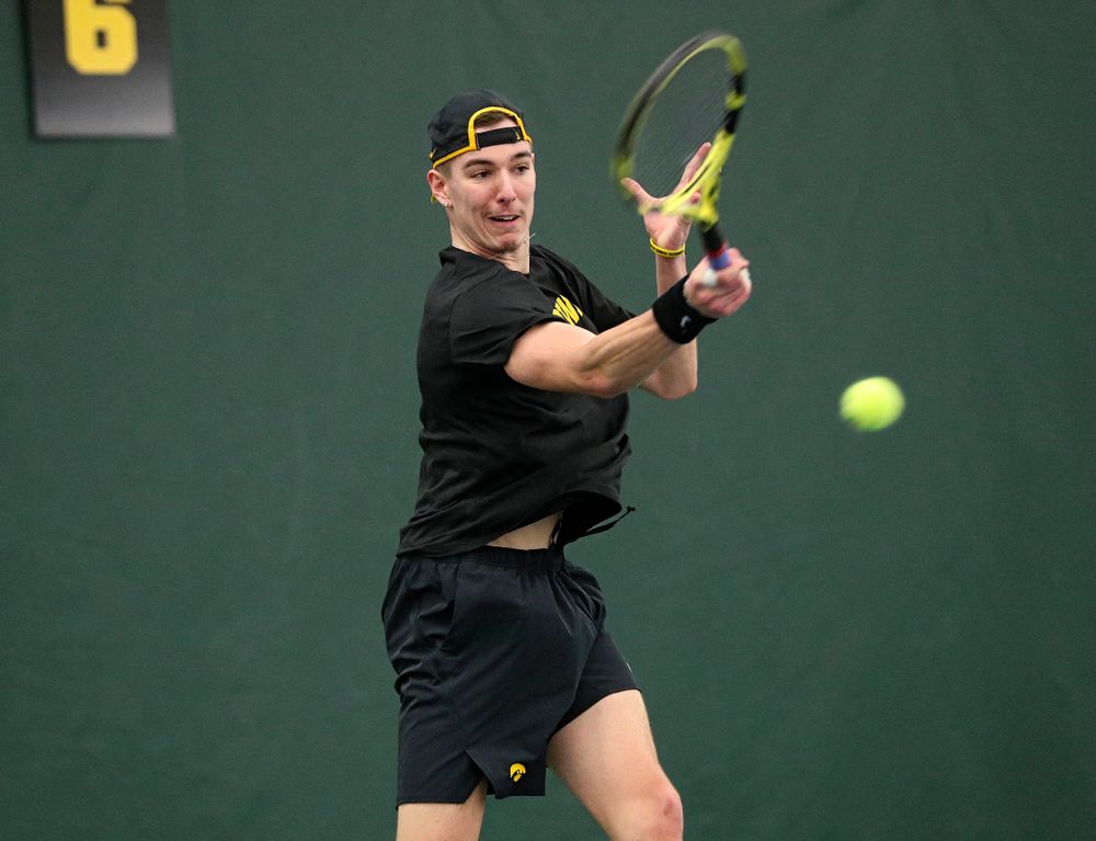Iowa’s Nikita Snezhko returns a shot during his singles match at the Hawkeye Tennis and Recreation Complex in Iowa City on Friday, February 14, 2020. (Stephen Mally/hawkeyesports.com)