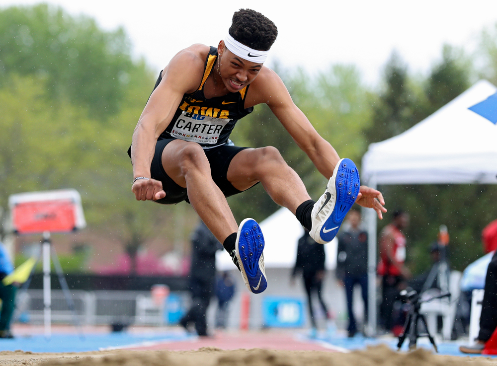 Iowa's James Carter jumps in the men’s long jump event on the second day of the Big Ten Outdoor Track and Field Championships at Francis X. Cretzmeyer Track in Iowa City on Saturday, May. 11, 2019. (Stephen Mally/hawkeyesports.com)