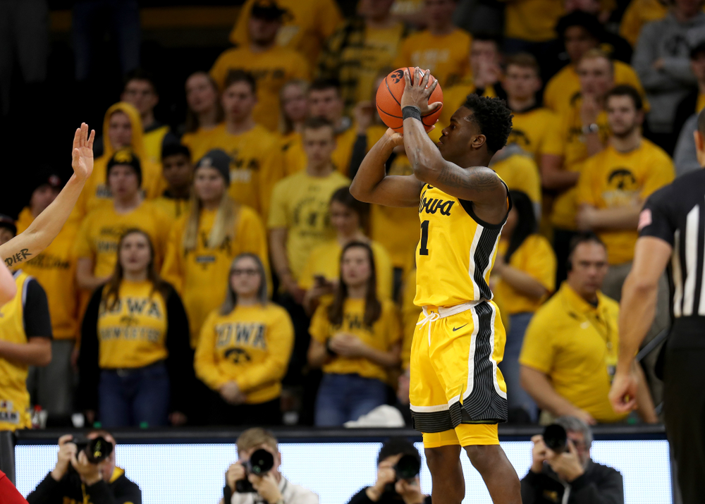 Iowa Hawkeyes guard Joe Toussaint (1) knocks down a three point basket against the Rutgers Scarlet Knights Wednesday, January 22, 2020 at Carver-Hawkeye Arena. (Brian Ray/hawkeyesports.com)