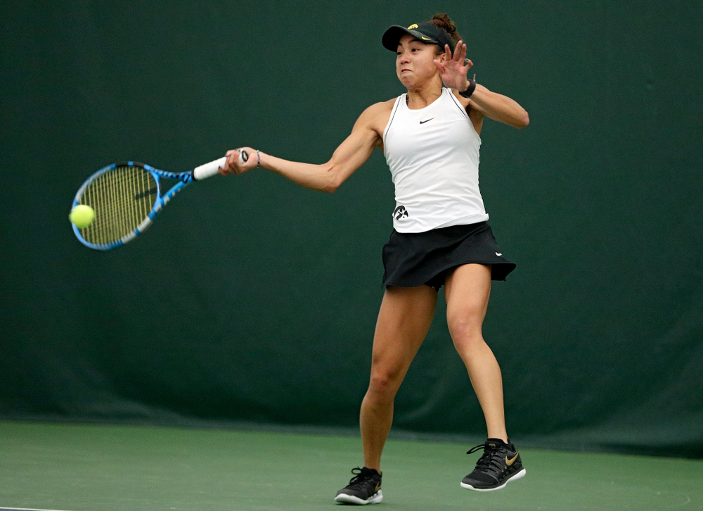 Iowa’s Michelle Bacalla returns a shot during her singles match at the Hawkeye Tennis and Recreation Complex in Iowa City on Sunday, February 16, 2020. (Stephen Mally/hawkeyesports.com)
