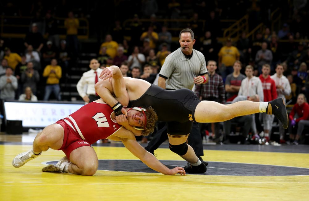 IowaÕs Tony Cassioppi wrestles WisconsinÕs Trent Hillger at heavyweight Sunday, December 1, 2019 at Carver-Hawkeye Arena. Cassioppi won the match 3-2. (Brian Ray/hawkeyesports.com)