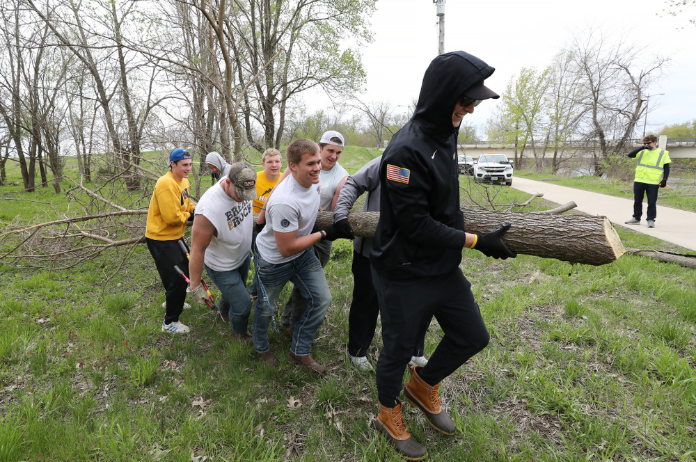 Members of the Hawkeye Football team volunteer with the Iowa City Public Works department along the Iowa River during the annual Iowa Athletics Day of Caring Sunday, April 28, 2019 in Iowa City. (Brian Ray/hawkeyesports.com)