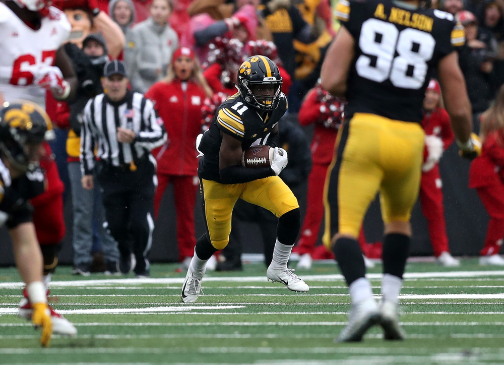 Iowa Hawkeyes defensive back Michael Ojemudia (11) intercepts a pass against the Nebraska Cornhuskers Friday, November 23, 2018 at Kinnick Stadium. (Brian Ray/hawkeyesports.com)