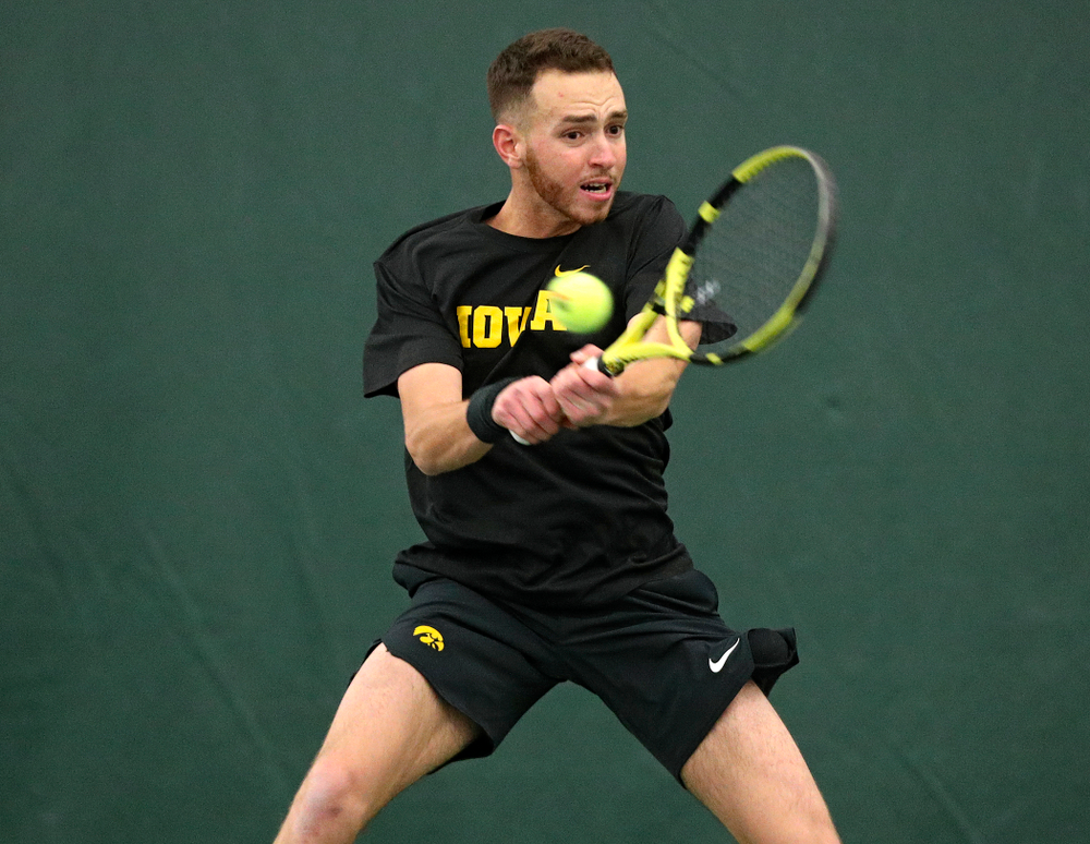 Iowa’s Kareem Allaf returns a shot during his singles match at the Hawkeye Tennis and Recreation Complex in Iowa City on Friday, February 14, 2020. (Stephen Mally/hawkeyesports.com)