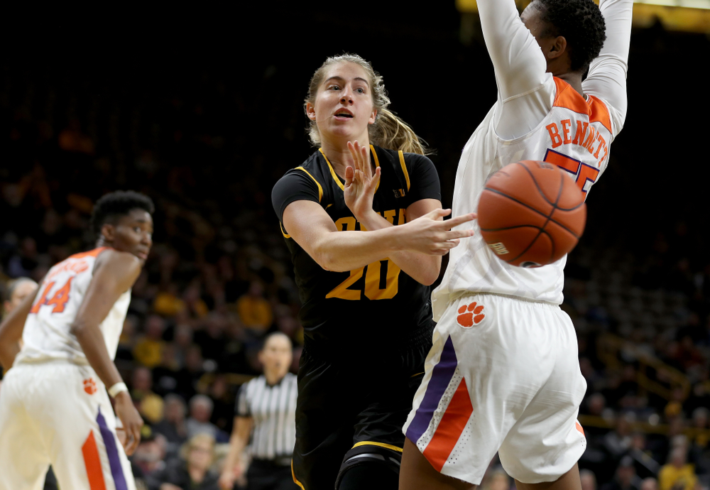 Iowa Hawkeyes guard Kate Martin (20) dishes off a pass against Clemson Wednesday, December 4, 2019 at Carver-Hawkeye Arena. (Brian Ray/hawkeyesports.com)
