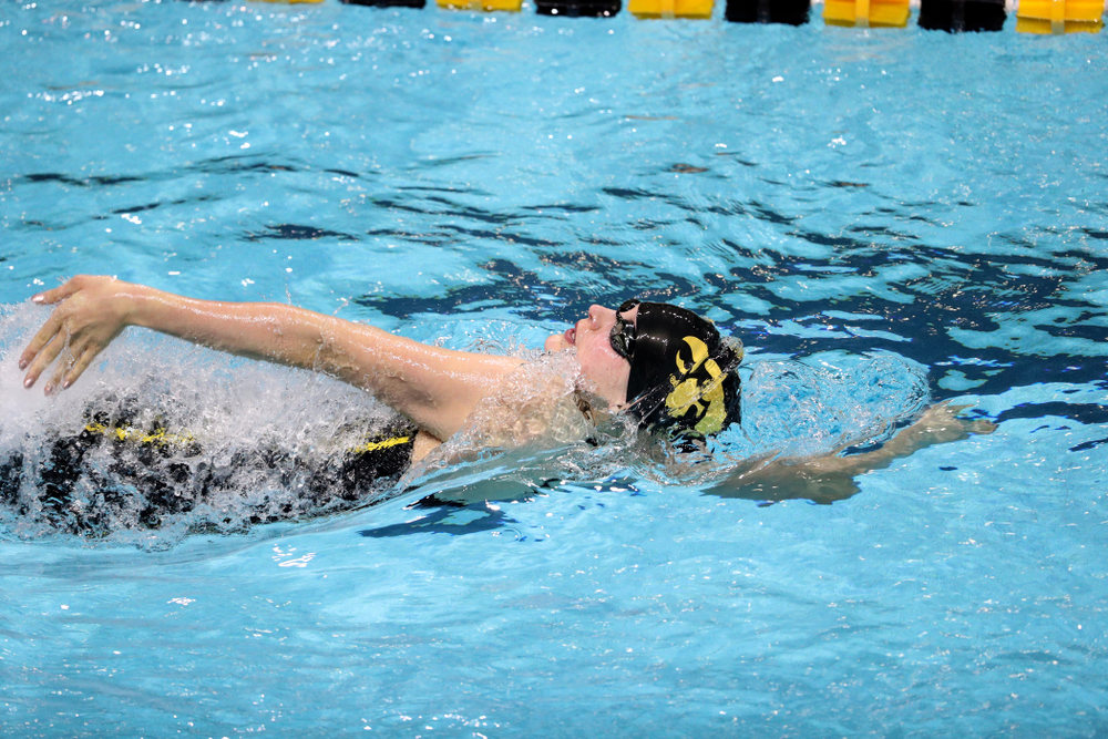 Iowa's Hannah Burvill swims the backstroke leg of the 200-yard medley relay against the Iowa State Cyclones in the Iowa Corn Cy-Hawk Series Friday, December 7, 2018 at at the Campus Recreation and Wellness Center. (Brian Ray/hawkeyesports.com)