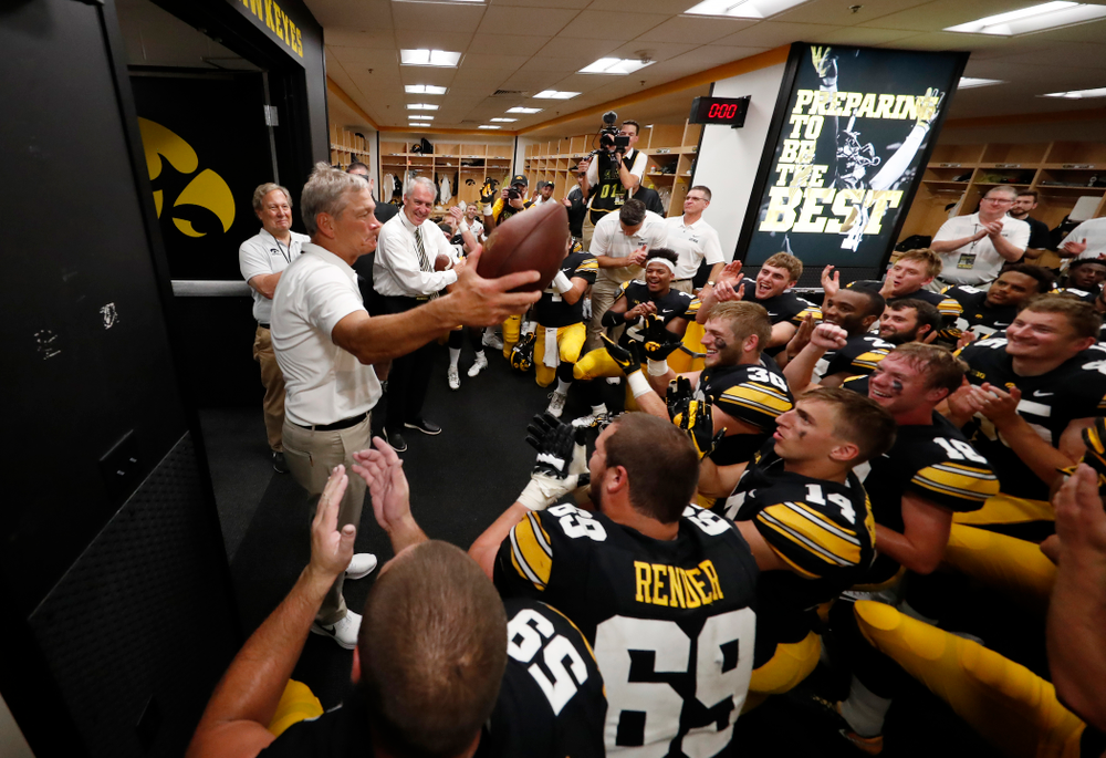 Iowa Hawkeyes head coach Kirk Ferentz celebrates his historic victory with his team following their game against the Northern Illinois Huskies Saturday, September 1, 2018 at Kinnick Stadium. (Brian Ray/hawkeyesports.com)