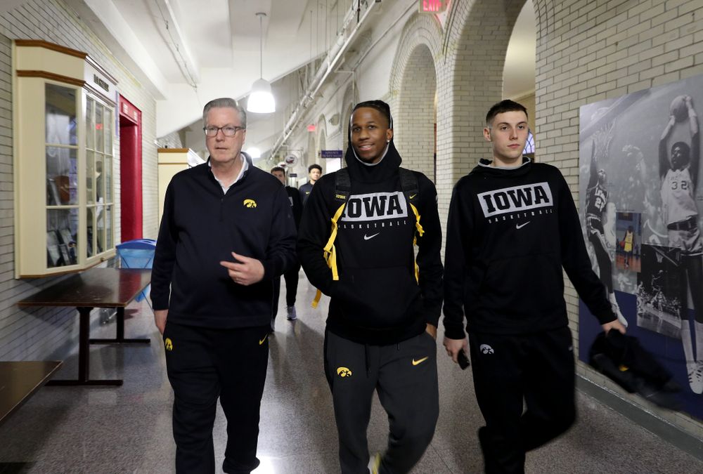 Iowa Hawkeyes head coach Fran McCaffery, guard Bakari Evelyn (4), and guard CJ Fredrick (5) arrive for practice at the Palestra Friday, January 3, 2020 in Philadelphia. (Brian Ray/hawkeyesports.com)