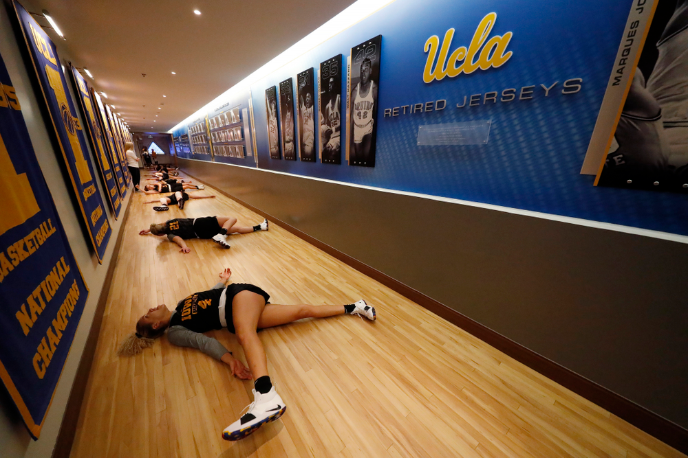 The Iowa Hawkeyes warmup before practice Friday, March 16, 2018 in the hallways of Pauley Pavilion on the campus of UCLA. (Brian Ray/hawkeyesports.com)