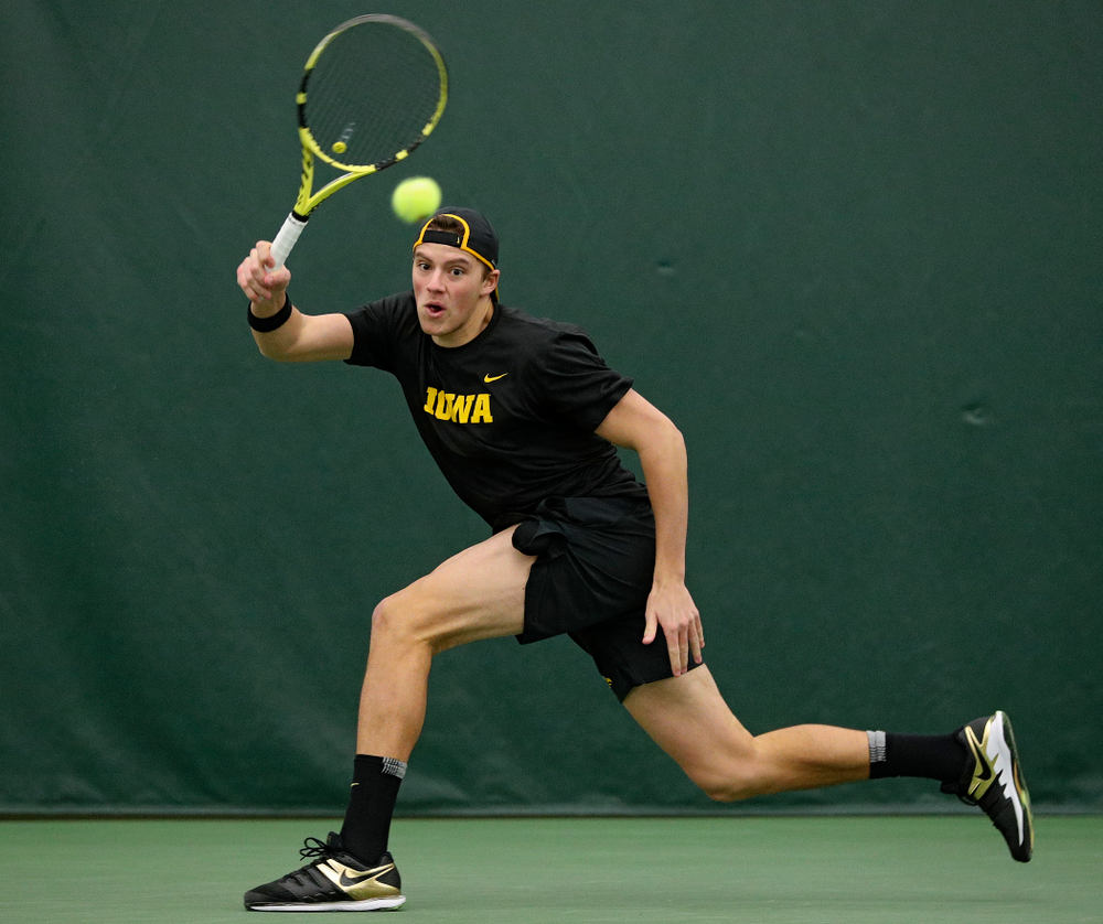 Iowa’s Joe Tyler returns a shot during their match at the Hawkeye Tennis and Recreation Complex in Iowa City on Thursday, January 16, 2020. (Stephen Mally/hawkeyesports.com)