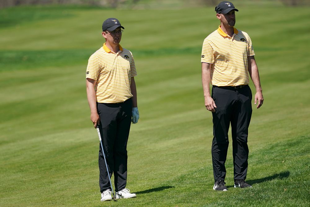 Iowa Matthew Walker (from left) talks with head coach Tyler Stith during the third round of the Hawkeye Invitational at Finkbine Golf Course in Iowa City on Sunday, Apr. 21, 2019. (Stephen Mally/hawkeyesports.com)