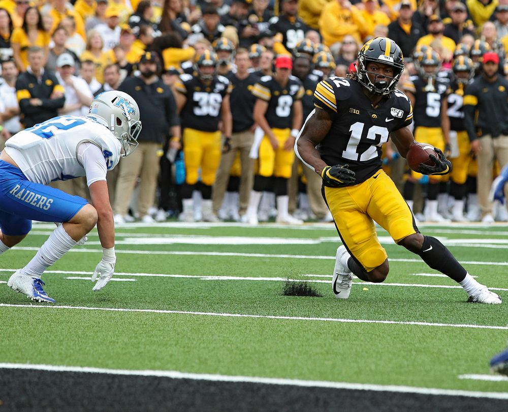 Iowa Hawkeyes wide receiver Brandon Smith (12) on a 10-yard touchdown reception during fourth quarter of their game at Kinnick Stadium in Iowa City on Saturday, Sep 28, 2019. (Stephen Mally/hawkeyesports.com)