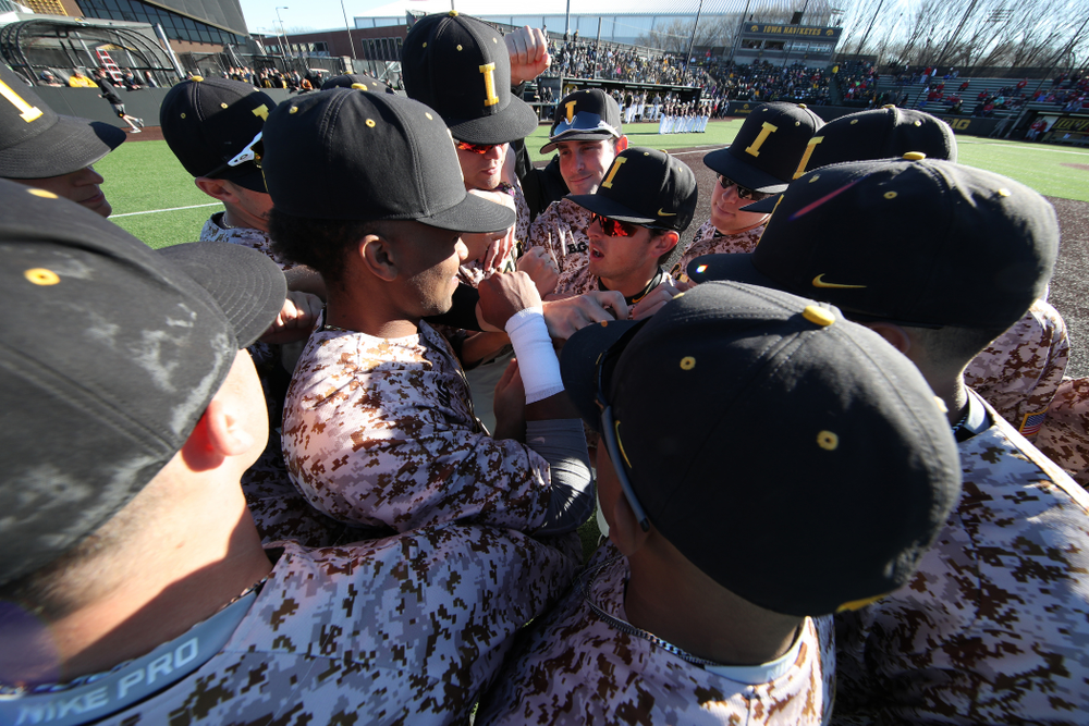 The Iowa Hawkeyes gather before their game against the Nebraska Cornhuskers on Military Appreciation Night Friday, April 19, 2019 at Duane Banks Field. (Brian Ray/hawkeyesports.com)