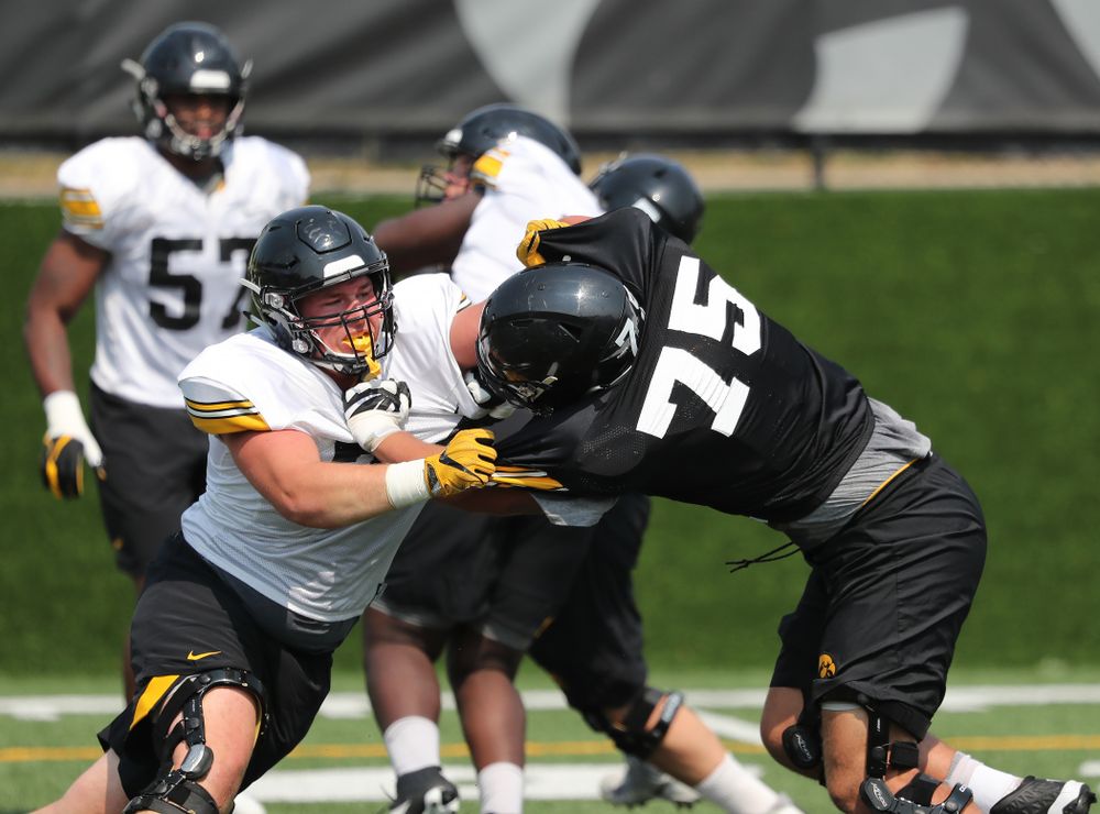 Iowa Hawkeyes defensive end Austin Schulte (74) against offensive lineman Jeff Jenkins (75) during the third practice of fall camp Sunday, August 5, 2018 at the Kenyon Football Practice Facility. (Brian Ray/hawkeyesports.com)