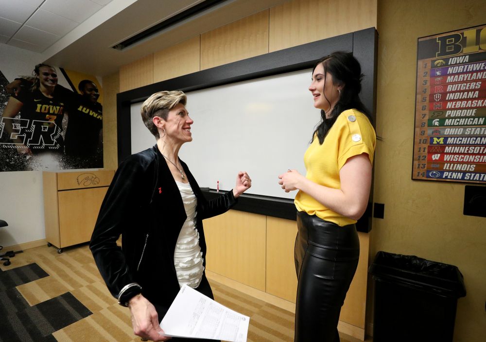 Megan Gustafson talks with associate head coach Jan Jensen following a jersey retirement ceremony Sunday, January 26, 2020 at Carver-Hawkeye Arena. (Brian Ray/hawkeyesports.com)