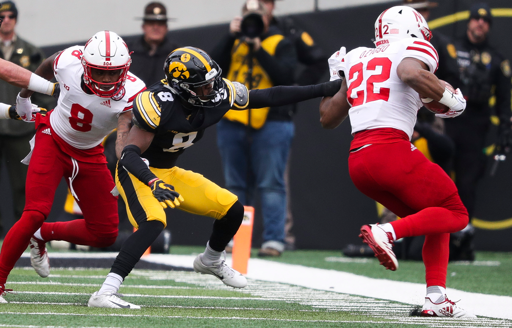 Iowa Hawkeyes defensive back Matt Hankins (8) pushes the ballcarrier out of bounds during a game against Nebraska at Kinnick Stadium on November 23, 2018. (Tork Mason/hawkeyesports.com)