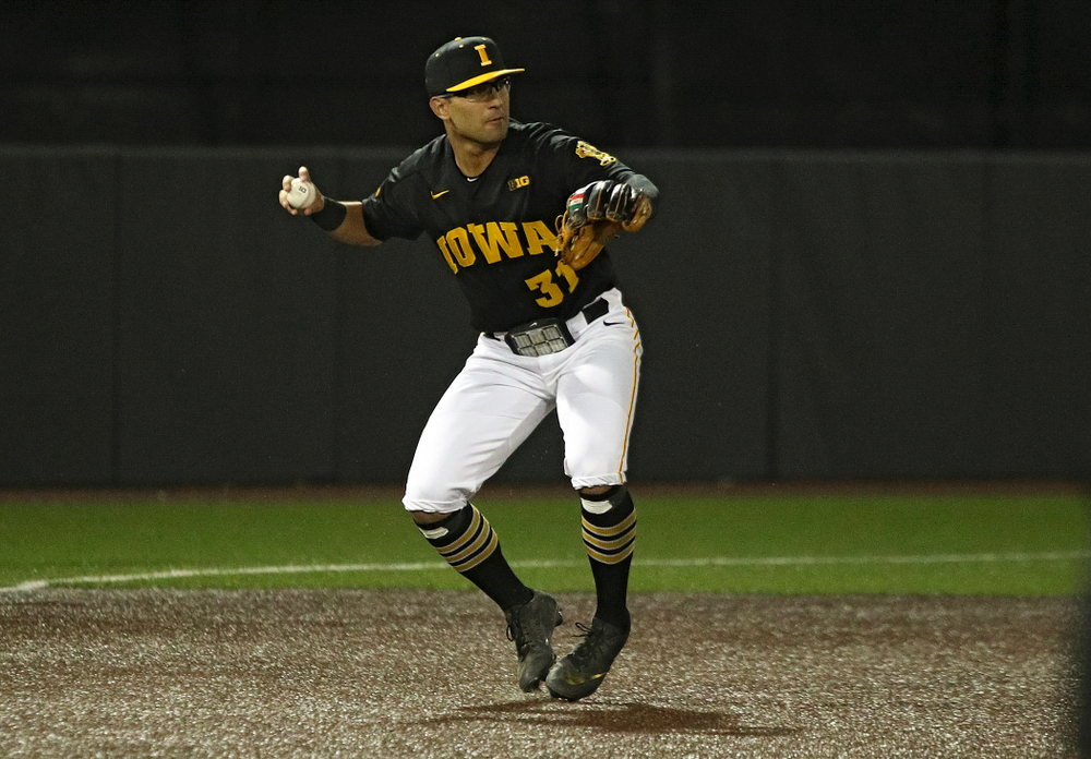 Iowa infielder Matthew Sosa (31) throws to second base to start a double play during the eighth inning of their game at Duane Banks Field in Iowa City on Tuesday, March 3, 2020. (Stephen Mally/hawkeyesports.com)