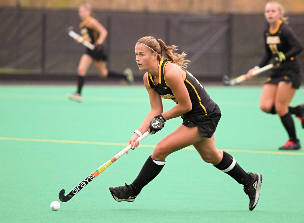 Iowa’s Sophie Sunderland (20) looks down field as she moves with the ball during the first quarter of their game at Grant Field in Iowa City on Saturday, Oct 26, 2019. (Stephen Mally/hawkeyesports.com)
