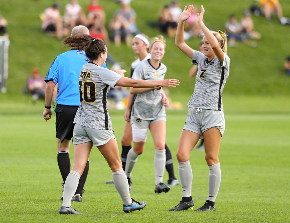 Iowa forward Devin Burns (30) celebrates with midfielder Hailey Rydberg (2) after Burns scored a goal during the first half of their match at the Iowa Soccer Complex in Iowa City on Sunday, Sep 1, 2019. (Stephen Mally/hawkeyesports.com)