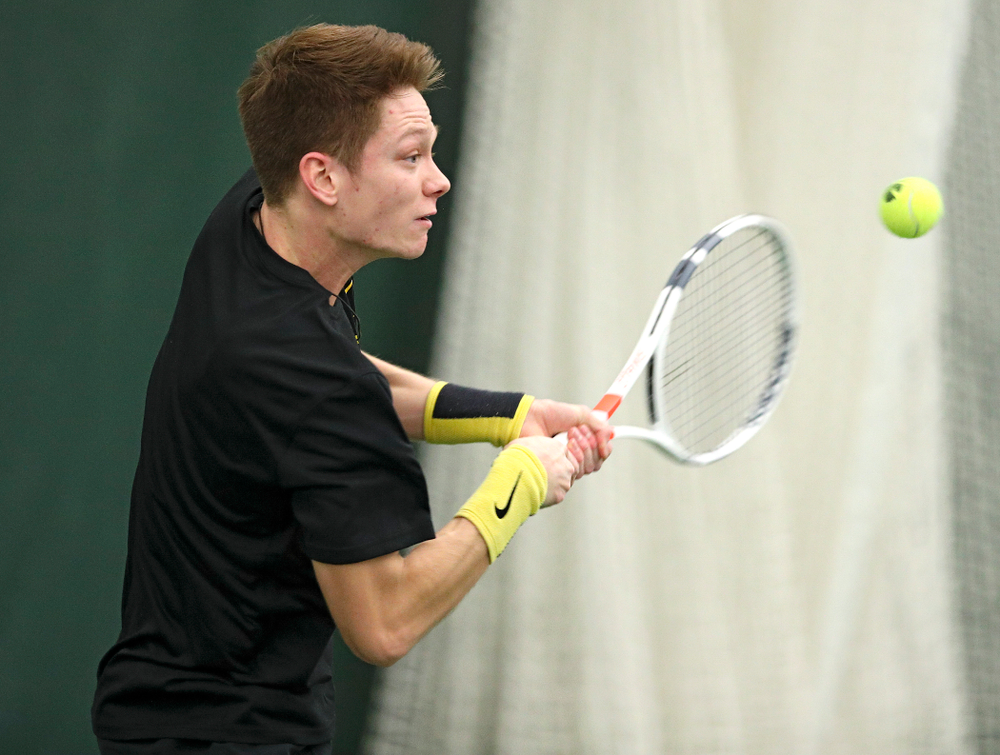 Iowa’s Jason Kerst returns a shot during their match at the Hawkeye Tennis and Recreation Complex in Iowa City on Thursday, January 16, 2020. (Stephen Mally/hawkeyesports.com)