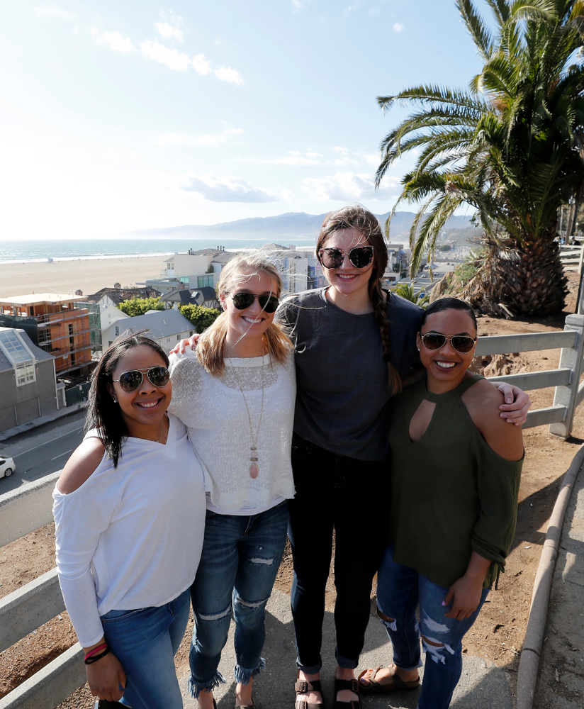 Iowa Hawkeyes guard Tania Davis (11), guard Makenzie Meyer (3), forward Megan Gustafson (10), and guard Alexis Sevillian (5) as they explore the beach Thursday, March 15, 2018 in Santa Monica. (Brian Ray/hawkeyesports.com)