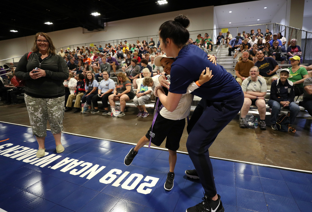 Iowa Hawkeyes forward Megan Gustafson (10) hugs a young fan at the Tourney Town Fan Fest Friday, April 5, 2019 at the Tampa Convention Center in Tampa, FL. (Brian Ray/hawkeyesports.com)