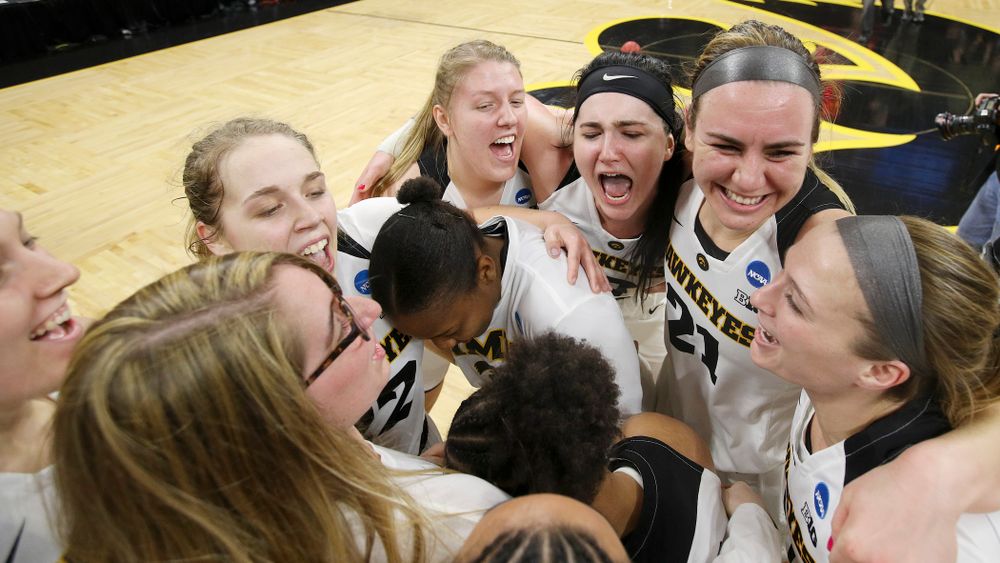 The Iowa Hawkeyes celebrate after winning their second round game in the 2019 NCAA Women's Basketball Tournament at Carver Hawkeye Arena in Iowa City on Sunday, Mar. 24, 2019. (Stephen Mally for hawkeyesports.com)