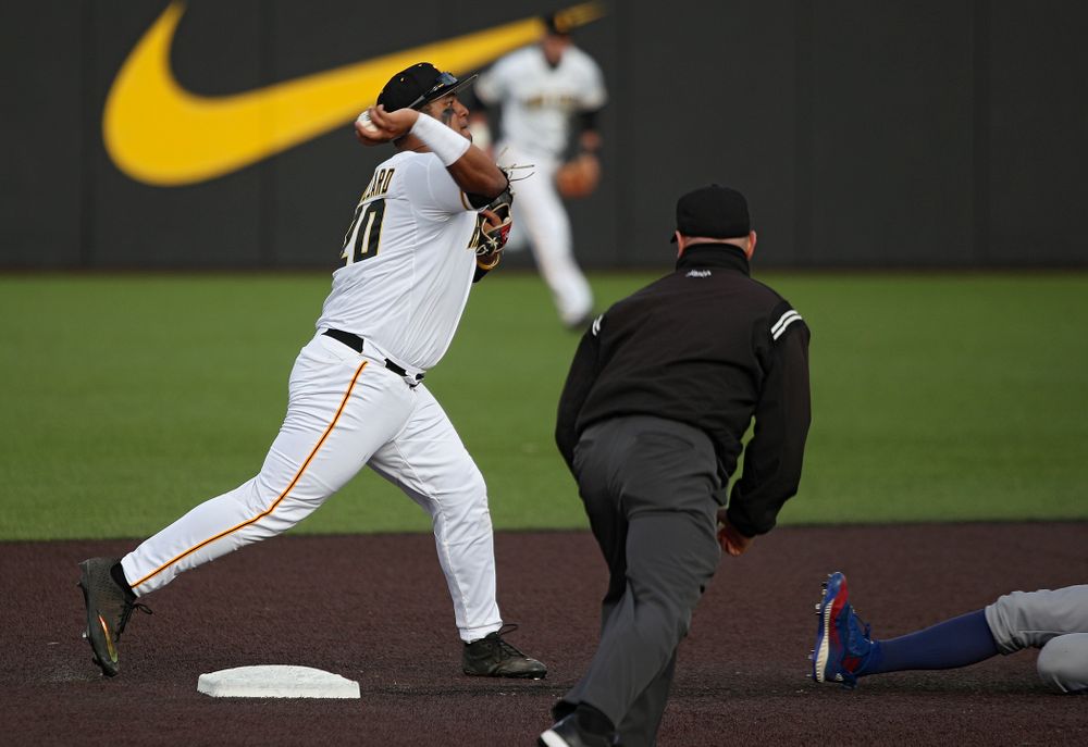 Iowa infielder Izaya Fullard (20) throws to first base as they turn a double play during the eighth inning of their college baseball game at Duane Banks Field in Iowa City on Wednesday, March 11, 2020. (Stephen Mally/hawkeyesports.com)
