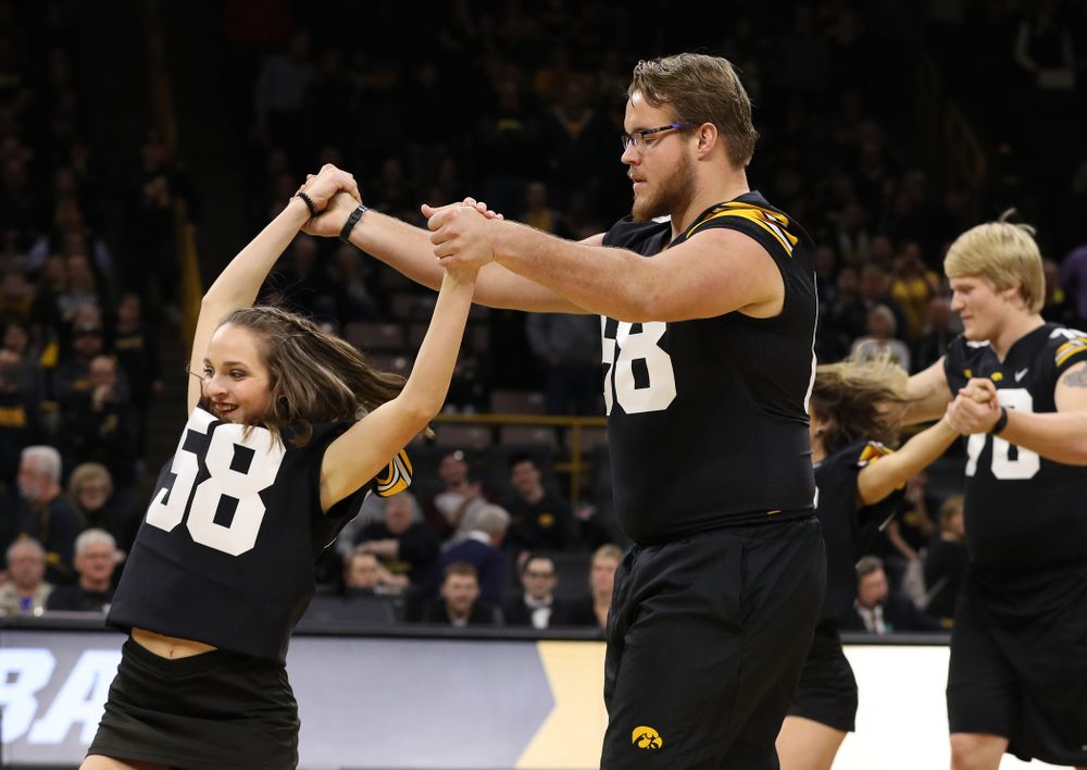The Iowa Dance Team performs with the Iowa Football Team at halftime of the Iowa Hawkeyes game against the Indiana Hoosiers Friday, February 22, 2019 at Carver-Hawkeye Arena. (Brian Ray/hawkeyesports.com)