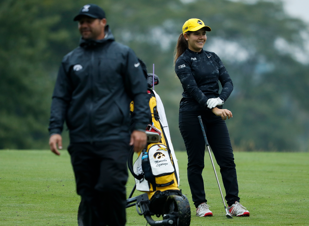 Iowa's Manuela Lizarazu laughs at a joke by assistant coach Michael Roters during the final round of the Diane Thomason Invitational at Finkbine Golf Course on September 30, 2018. (Tork Mason/hawkeyesports.com)