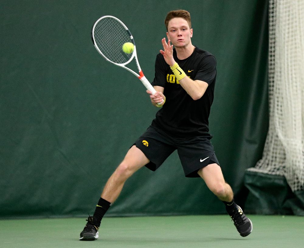 Iowa’s Jason Kerst returns a shot during his singles match at the Hawkeye Tennis and Recreation Complex in Iowa City on Friday, February 14, 2020. (Stephen Mally/hawkeyesports.com)