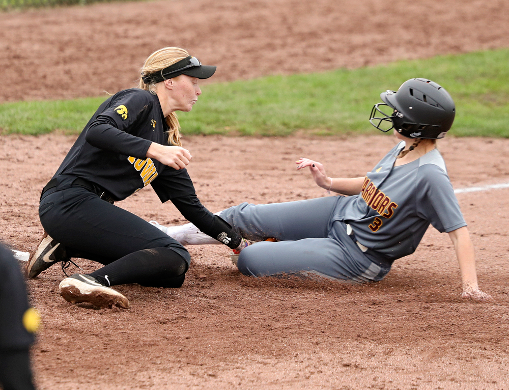 Iowa third basemans Ashley Hamilton (18) tags out a runner trying to steal during the fifth inning of their game against Iowa Softball vs Indian Hills Community College at Pearl Field in Iowa City on Sunday, Oct 6, 2019. (Stephen Mally/hawkeyesports.com)