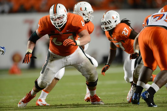 Hunter Wells #64 and the 14th ranked University of Miami Hurricanes play the Georgia Tech Yellow Jackets at Sun Life Stadium on October 5, 2013. ...