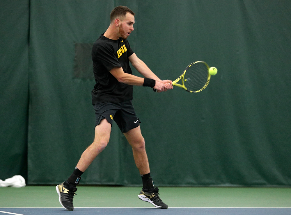 Iowa’s Kareem Allaf returns a shot during his singles match at the Hawkeye Tennis and Recreation Complex in Iowa City on Friday, March 6, 2020. (Stephen Mally/hawkeyesports.com)