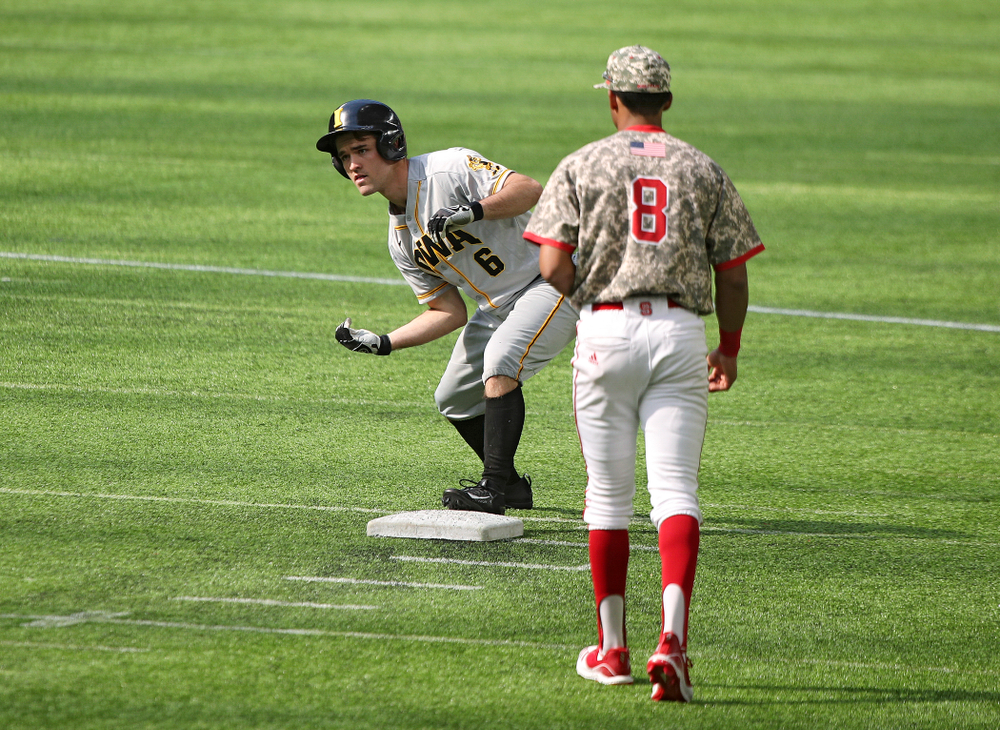 Iowa Hawkeyes outfielder Justin Jenkins (6) celebrates after hitting an RBI double during the seventh inning of their CambriaCollegeClassic game at U.S. Bank Stadium in Minneapolis, Minn. on Friday, February 28, 2020. (Stephen Mally/hawkeyesports.com)