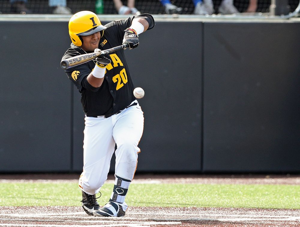 Iowa Hawkeyes designated hitter Izaya Fullard (20) gets a bunt single during the sixth inning of their game against Rutgers at Duane Banks Field in Iowa City on Saturday, Apr. 6, 2019. (Stephen Mally/hawkeyesports.com)