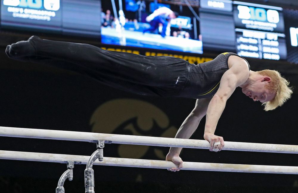 Iowa's Nick Merryman competes in the parallel bars during the first day of the Big Ten Men's Gymnastics Championships at Carver-Hawkeye Arena in Iowa City on Friday, Apr. 5, 2019. (Stephen Mally/hawkeyesports.com)