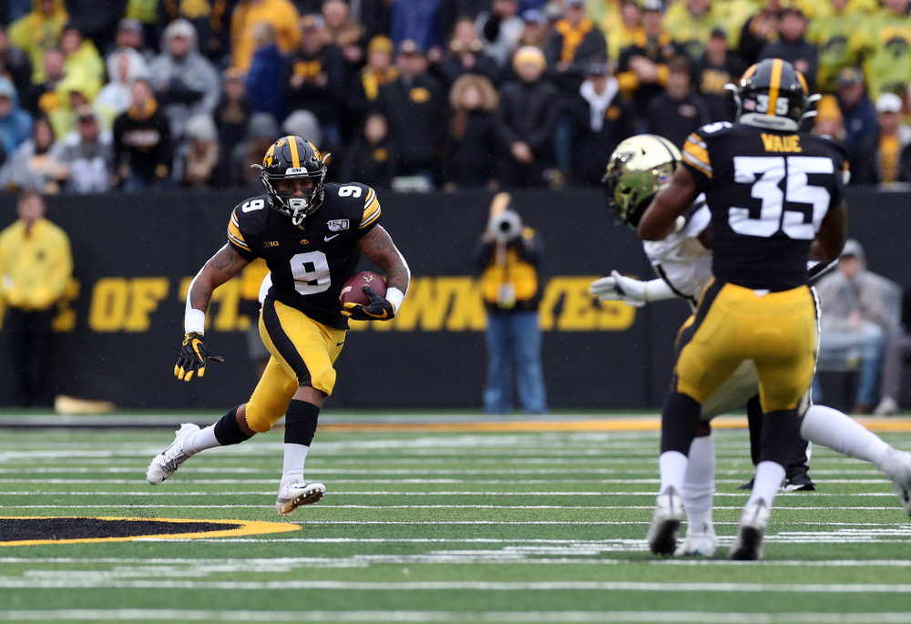 Iowa Hawkeyes defensive back Geno Stone (9) returns a punt against the Purdue Boilermakers Saturday, October 19, 2019 at Kinnick Stadium. (Brian Ray/hawkeyesports.com)