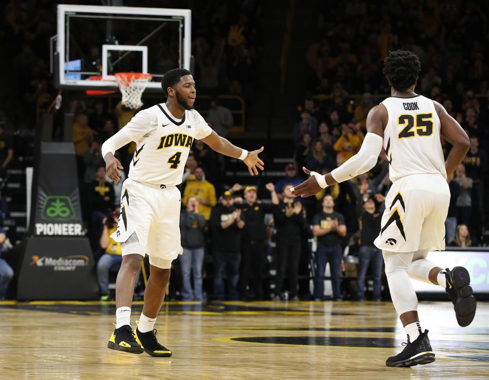 Iowa Hawkeyes guard Isaiah Moss (4) and forward Tyler Cook (25) against the Ohio State Buckeyes Saturday, January 12, 2019 at Carver-Hawkeye Arena. (Brian Ray/hawkeyesports.com)