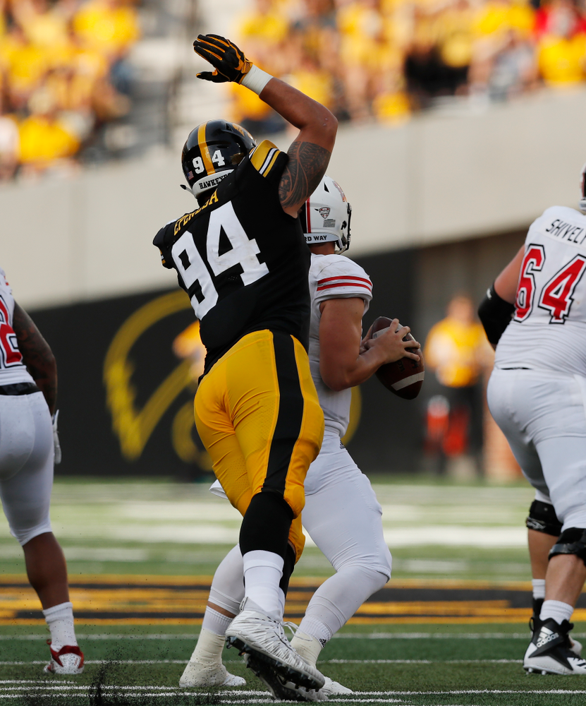 Iowa Hawkeyes defensive end A.J. Epenesa (94) strips Northern Illinois Huskies quarterback Marcus Childers (15) Saturday, September 1, 2018 at Kinnick Stadium. (Brian Ray/hawkeyesports.com)