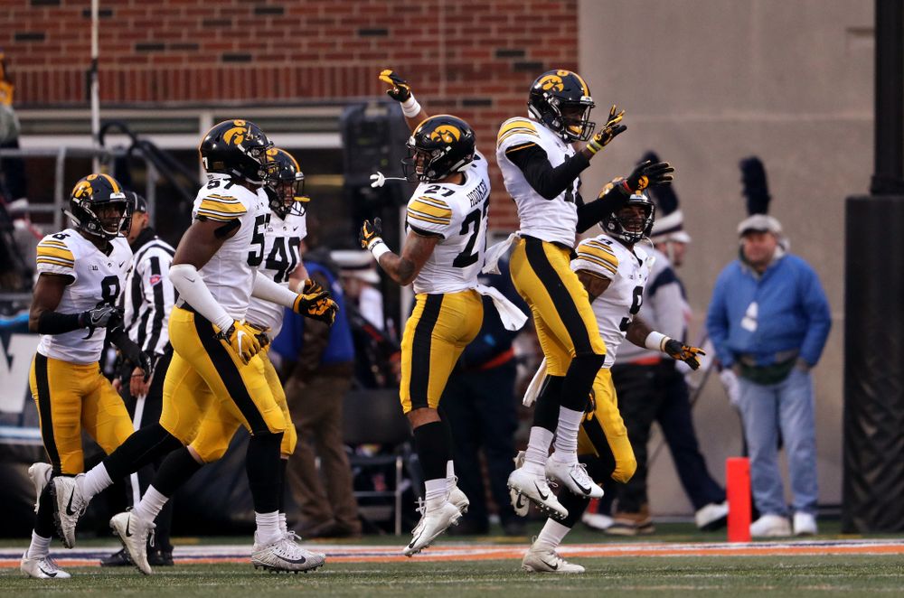 Iowa Hawkeyes defensive back Michael Ojemudia (11) celebrates after intercepting a pass against the Illinois Fighting Illini Saturday, November 17, 2018 at Memorial Stadium in Champaign, Ill. (Brian Ray/hawkeyesports.com)