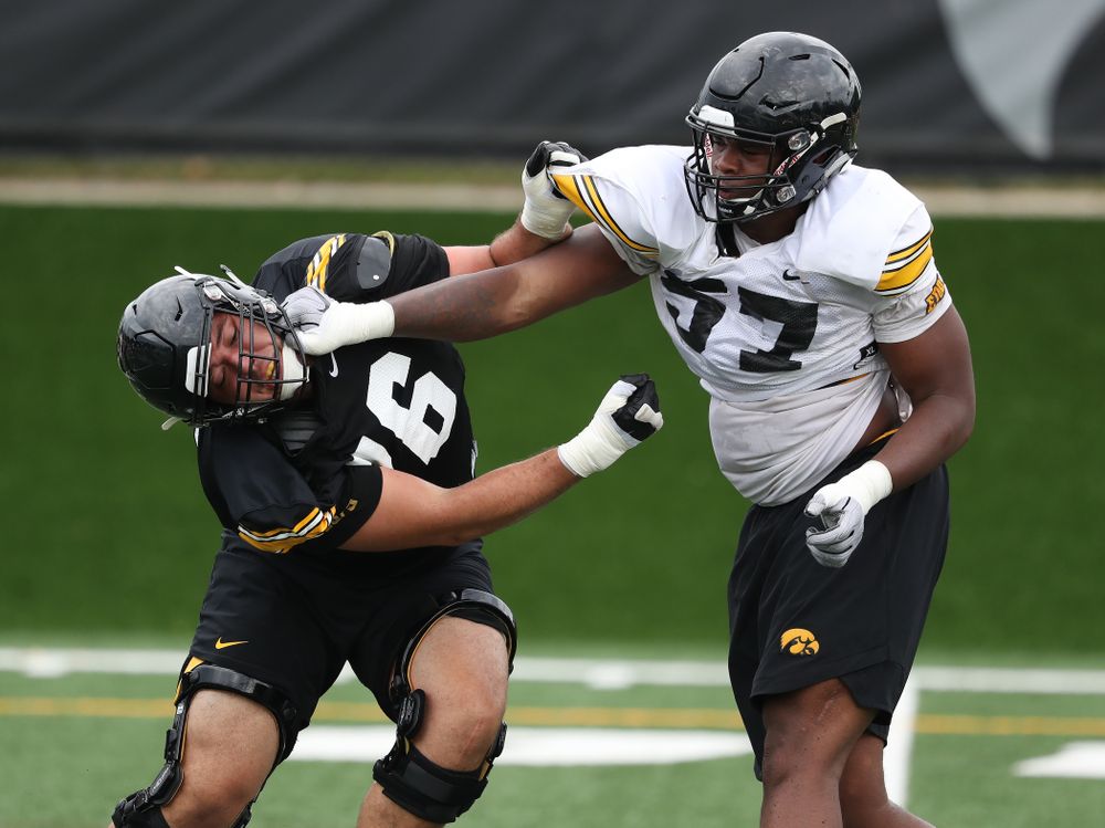 Iowa Hawkeyes offensive lineman Dalton Ferguson (76) and defensive end Chauncey Golston (57) during practice No. 4 of Fall Camp Monday, August 6, 2018 at the Hansen Football Performance Center. (Brian Ray/hawkeyesports.com)