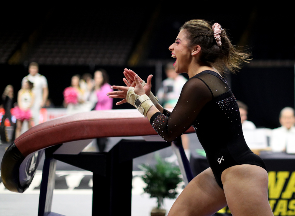 Iowa’s Ariana Agrapides competes on the vault against Michigan Friday, February 14, 2020 at Carver-Hawkeye Arena. (Brian Ray/hawkeyesports.com)