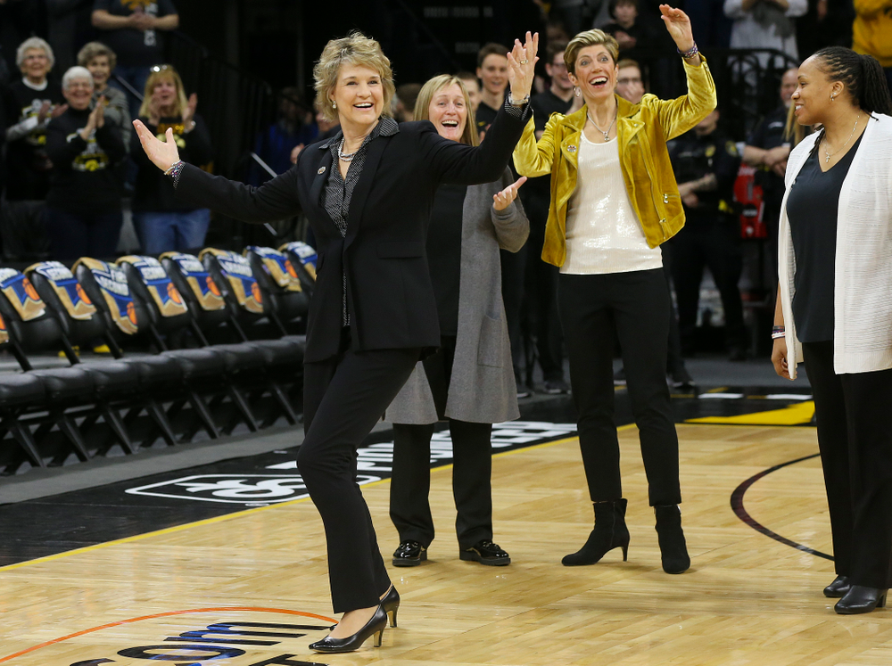 Iowa Hawkeyes head coach Lisa Bluder reacts after her daughter Emma Bluder (not pictured), didn't see her coming to hug her after Emma sung the National Anthem before their second round game in the 2019 NCAA Women's Basketball Tournament at Carver Hawkeye Arena in Iowa City on Sunday, Mar. 24, 2019. (Stephen Mally for hawkeyesports.com)