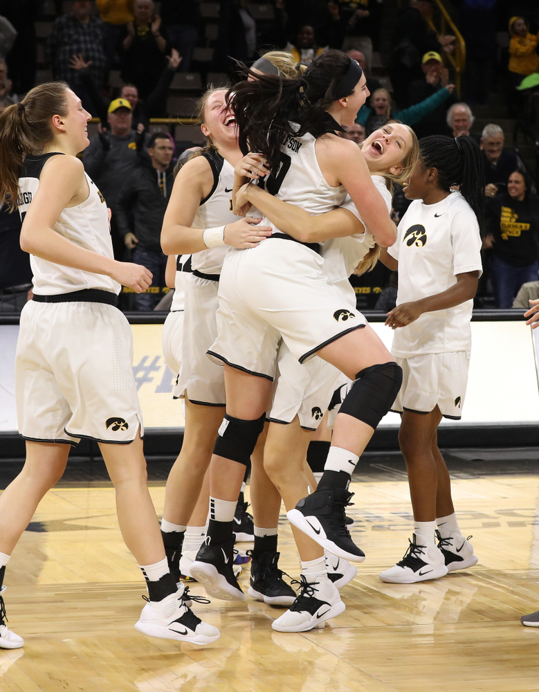 Iowa Hawkeyes forward Megan Gustafson (10) and forward Logan Cook (23) celebrate their victory over the Rutgers Scarlet Knights Wednesday, January 23, 2019 at Carver-Hawkeye Arena. (Brian Ray/hawkeyesports.com)