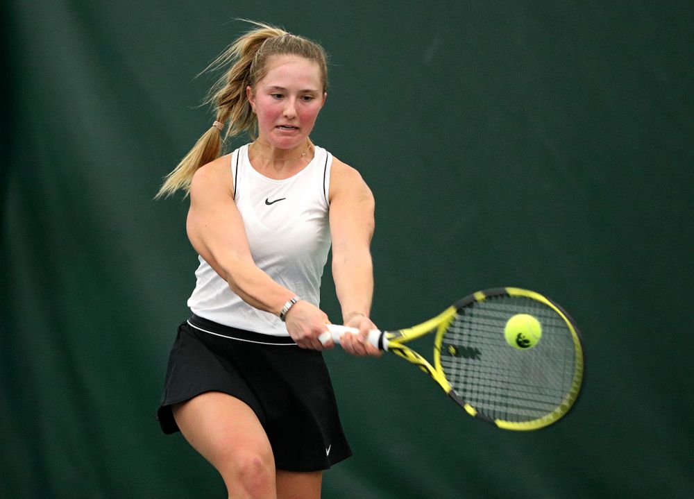 Iowa’s Danielle Burich returns a shot during her singles match at the Hawkeye Tennis and Recreation Complex in Iowa City on Sunday, February 16, 2020. (Stephen Mally/hawkeyesports.com)